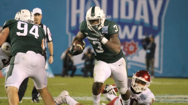 LJ Scott breaks free in the Holiday for the Spartans. (Photo: Duffy Carpenter, Spartan Nation @DuffyCarpenter1)